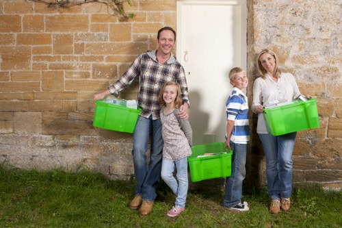 Family decluttering their living room in Temple